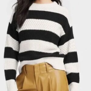 A new day cream and black striped crew neck sweater